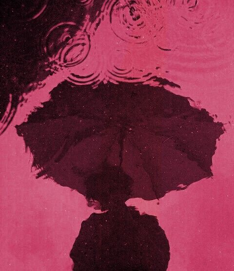 an umbrella is reflected in the water on a pink background with swirls and circles