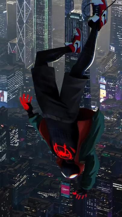 a spider - man leaps high into the air over a city