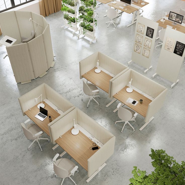 an overhead view of office cubicles with desks and chairs