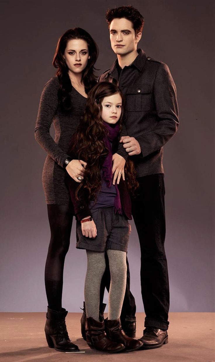 the twilight saga breaking dawn movie poster with edward pattis and his wife, lily