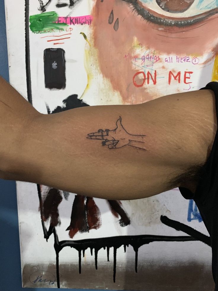 a person's arm with a tattoo on it