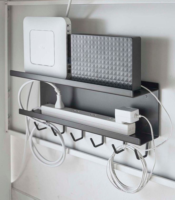 an electronic device is plugged into the wall with wires and cords attached to it