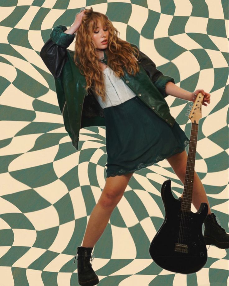 a woman holding a guitar in front of a green and white background