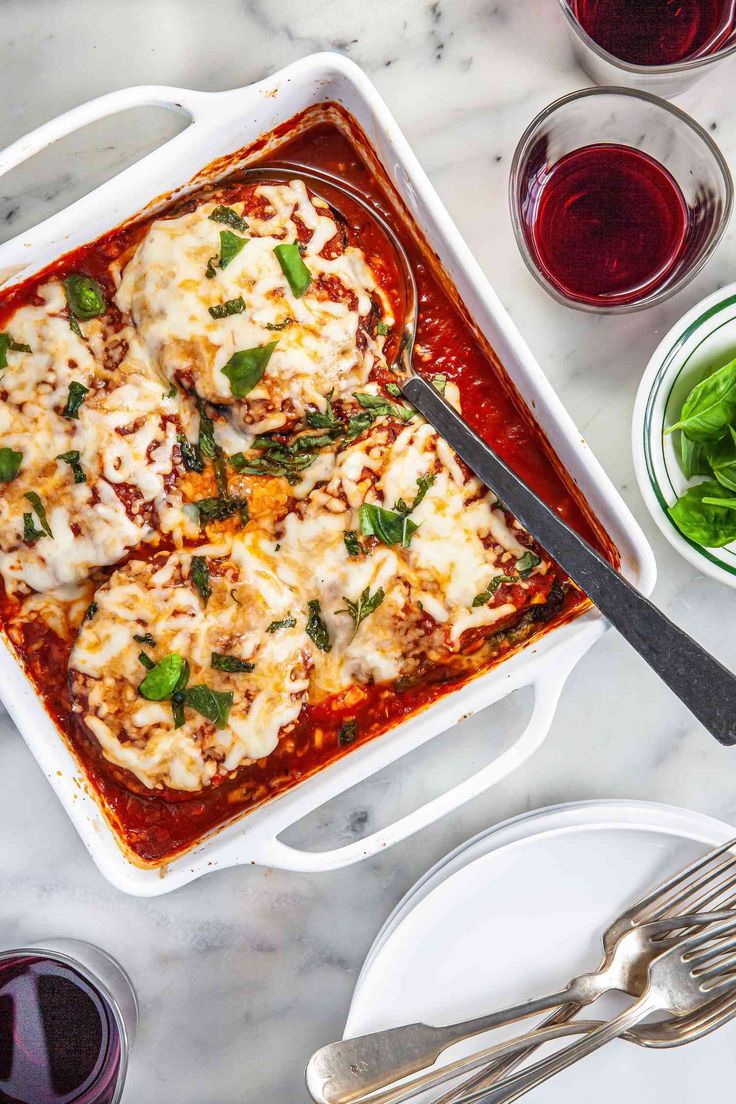 lasagna casserole with spinach and cheese on the side