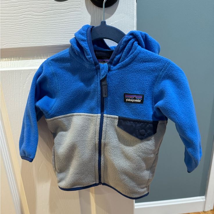 Blue And Gray Fleece Patagonia Zip Up Fleece Jacket For Baby. Brand New With Tags. Size 3-6 Months. Stock Photo From Patagonia Website Included For Reference Only! Patagonia Zip Up Fleece Jackets, Fleece Patagonia, Patagonia Zip Up, Patagonia Baby, Baby Patagonia, Patagonia Kids, Month Colors, Patagonia Jacket, Patagonia Jackets