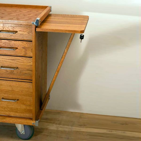 a wooden desk with four drawers on wheels