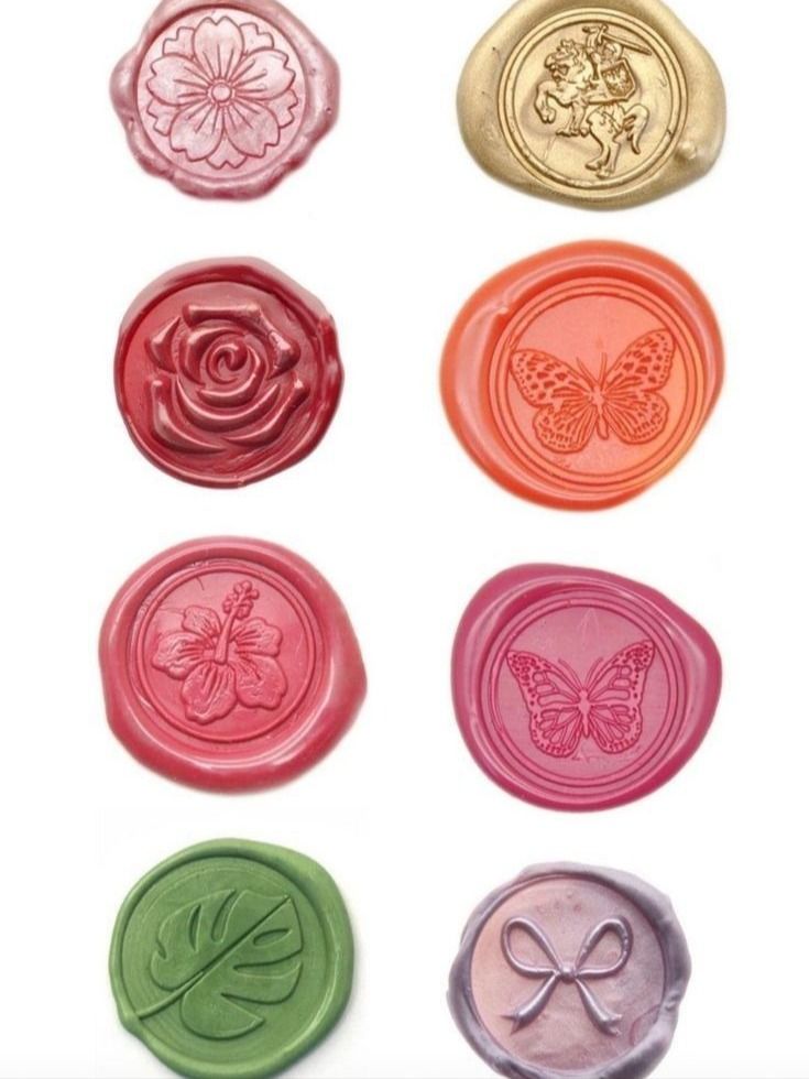 six wax seals with butterflies and flowers on them, all in different colors to choose from