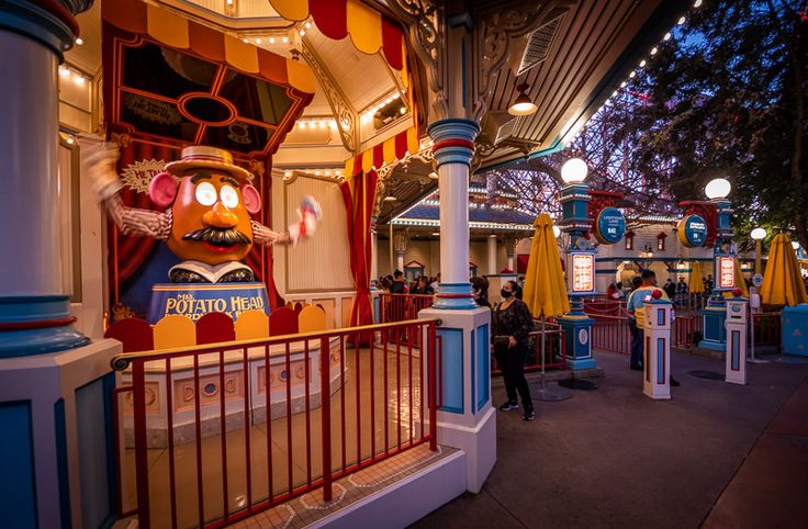 an amusement park at night with lights and decorations