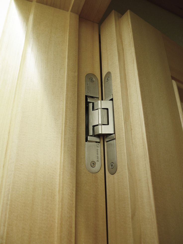 a close up of a wooden door with a latch