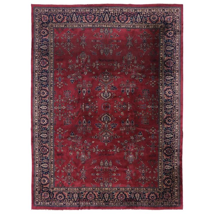 an antique persian rug with red and blue colors on the bottom, surrounded by ornate border