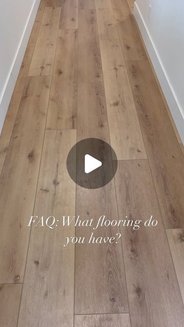 a hallway with white walls and wood flooring that says faq what flooring do you have?