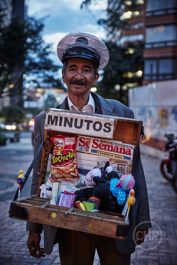 an old man holding a box full of stuff