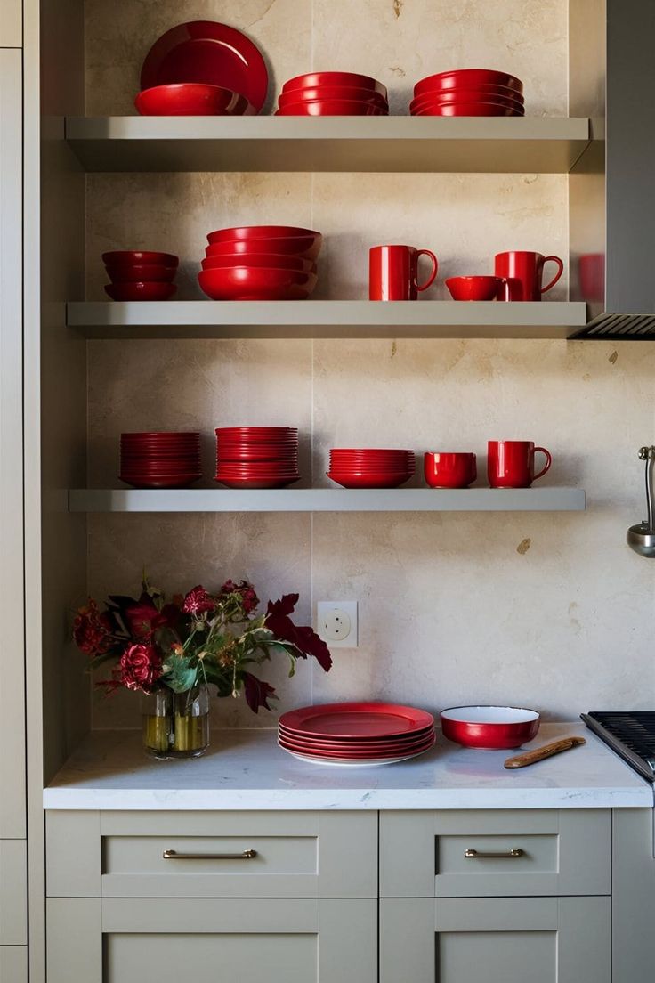 red plates and bowls on shelves in a kitchen