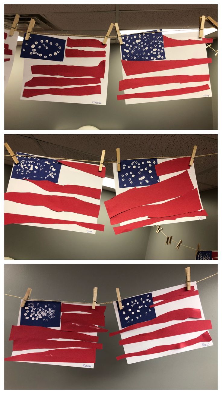 american flags are hung on clothes pins with clothes pins attached to them