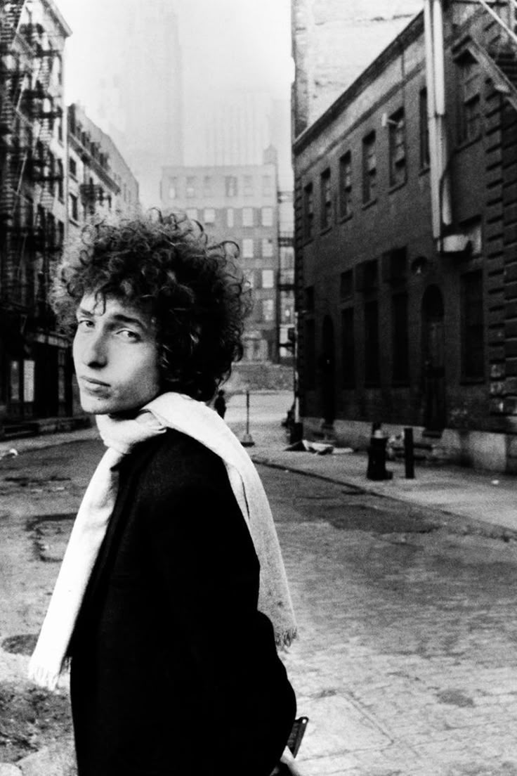 black and white photograph of a man with curly hair