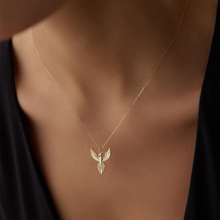 14K Solid Gold Phoenix Necklace - Gold Bird Pendant - Firebird Simurgh Necklace - Mom's Gift - Birthday Gift for Her - Best Gifts for Mothers Celebrate the spirit of renewal and strength with our 14K Solid Gold Phoenix Necklace. This stunning Gold Bird Pendant, inspired by the legendary Firebird Simurgh, is a meaningful and elegant piece perfect for gifting or adding to your personal collection. Features: 🔥 Premium Quality: Crafted from genuine 14K solid gold, this necklace offers lasting durab Necklace Pendants, Gold Necklace With Bird Design As Gift, Bird Design Pendant Necklace Gift, Phoenix Bird Necklace, Phoenix Necklace Pendants, Bird-shaped Bird-design Necklace For Gifts, Meaningful Necklace, Phoenix Necklace, Phoenix Pendant