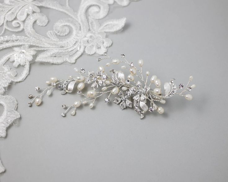 A dainty design of silver five-petal crystal flowers, matte silver ribbons, and ivory freshwater cultured pearls.Brighten your wedding day hairstyle with this lovely hair clip! It is about 5.75 inches long and 2 inches wide, on an alligator style pinch clip. Wedding Day Hairstyle, Bridal Clip, Crystal Flowers, Gold Headpiece, Headpiece Hairstyles, Bridal Hair Clip, Vintage Inspired Jewelry, Gold Jewelry Earrings, Freshwater Cultured Pearls