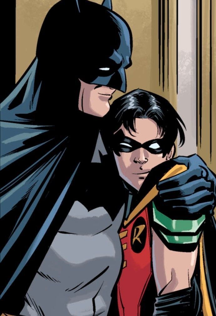 the batman and robin wayne are hugging each other