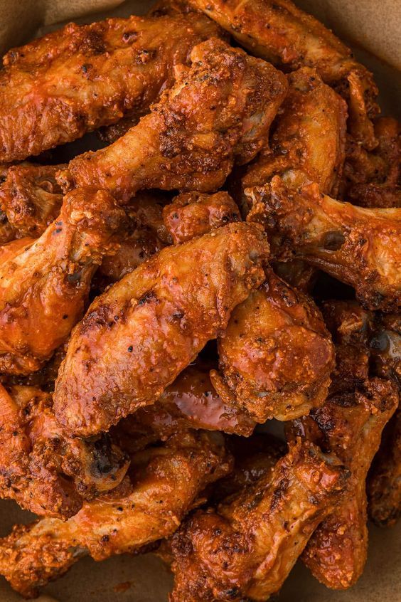 chicken wings in a paper bag on a table