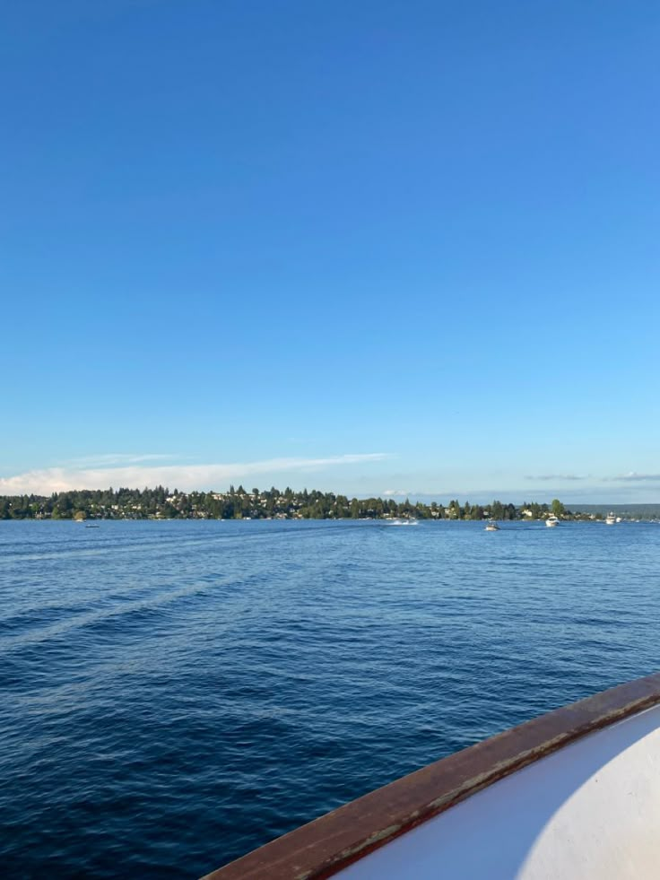 the back end of a boat traveling across a large body of water