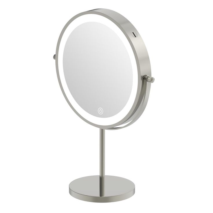 a round mirror on a metal stand