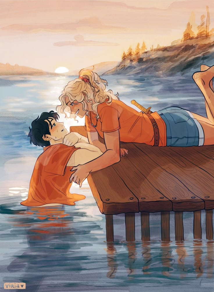 a man and woman are laying on a dock