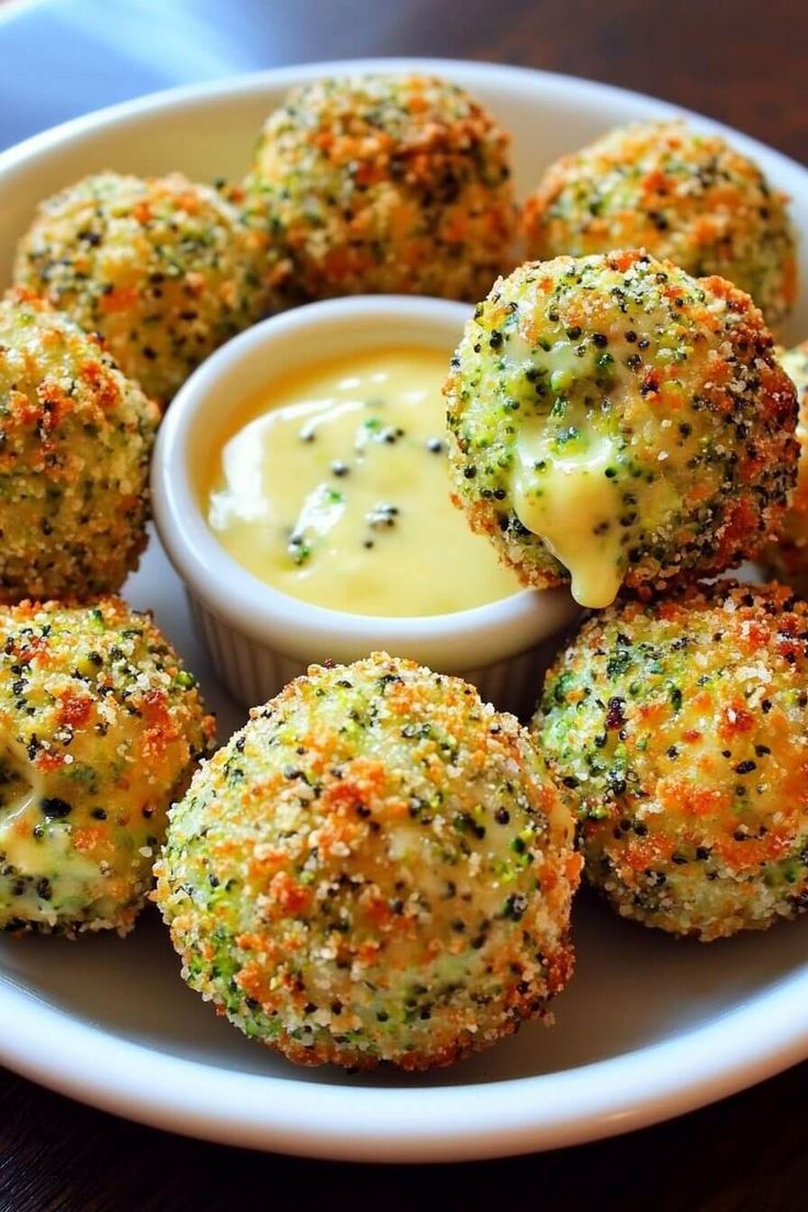 broccoli balls with dipping sauce on a plate