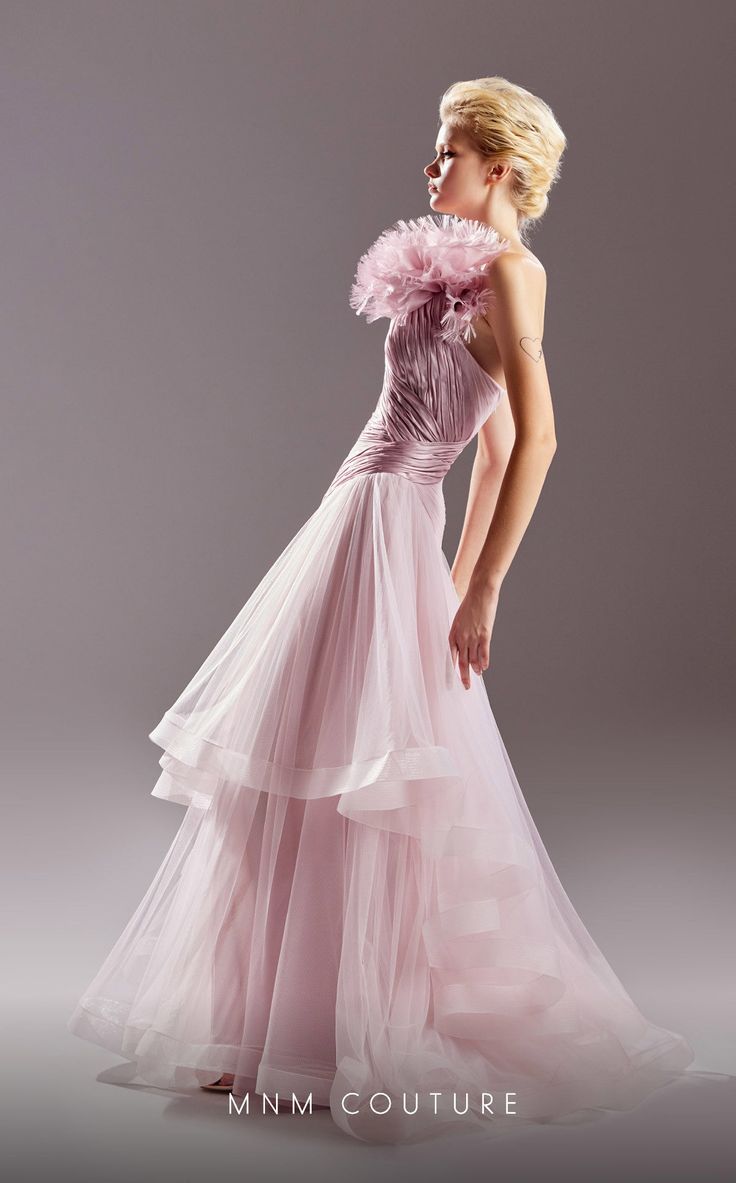 Make a statement at your next couture event, evening affair, or as the mother of the bride with the MNM Couture A-Line Evening Dress. This exquisite gown is crafted from a combination of tulle and organza, creating a stunning and ethereal look. The A-line style of the dress flatters all body types, gracefully skimming the waist and hips before cascading into a voluminous and flowing skirt. It offers a timeless and elegant silhouette that is both flattering and comfortable to wear. The pleating d Elegant Evening Organza Ball Gown, Formal Evening Dress With Fitted Bodice In Organza, Formal Organza Evening Dress With Fitted Bodice, Evening Dress With Detachable Train And Fitted Bodice, Elegant Organza Ball Gown With Sweep Train, Fitted Bodice Organza Evening Dress For Gala, Organza Evening Dress With Detachable Train For Gala, Elegant Organza Gown For Gala, Pink Tulle Evening Dress For Gala