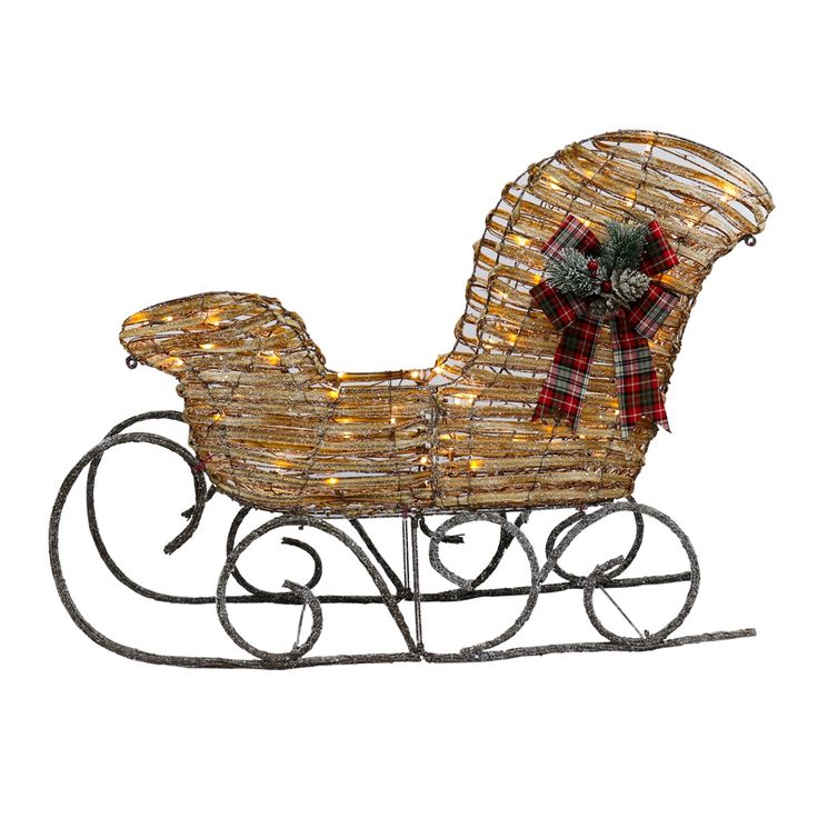 a christmas sleigh with lights and a bow on the top is shown against a white background