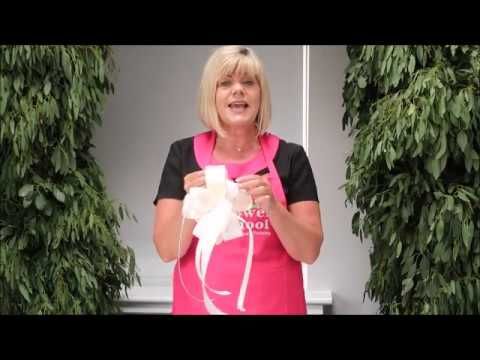 a woman in an apron is holding something