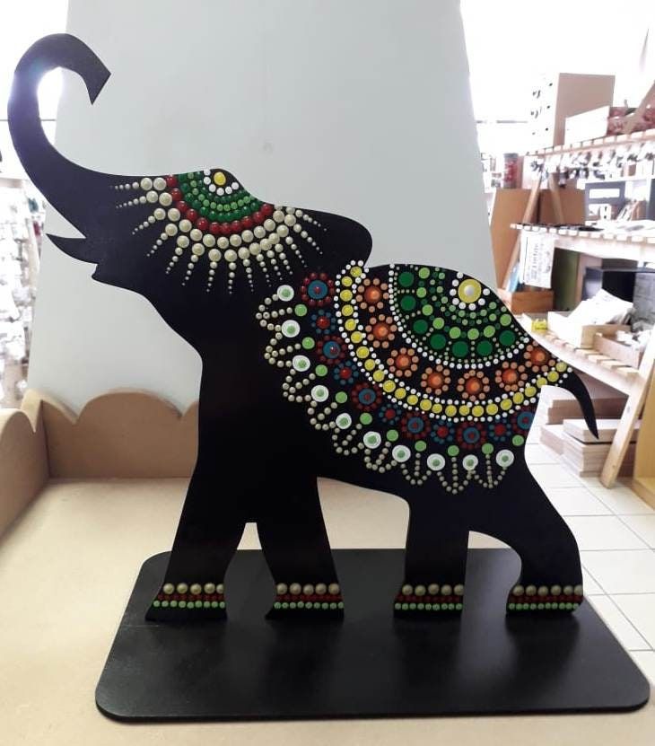 an elephant is decorated with jewels and beads