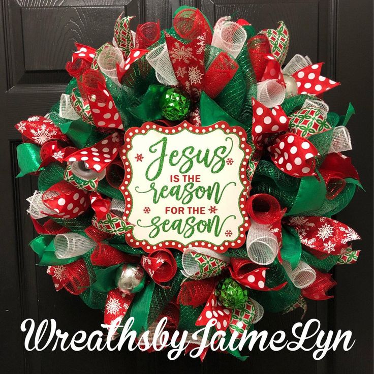 a christmas wreath that says jesus is the reason for the season