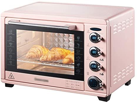 a pink toaster oven with some food in it