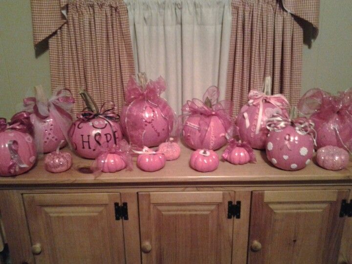 pink decorations are sitting on top of a dresser