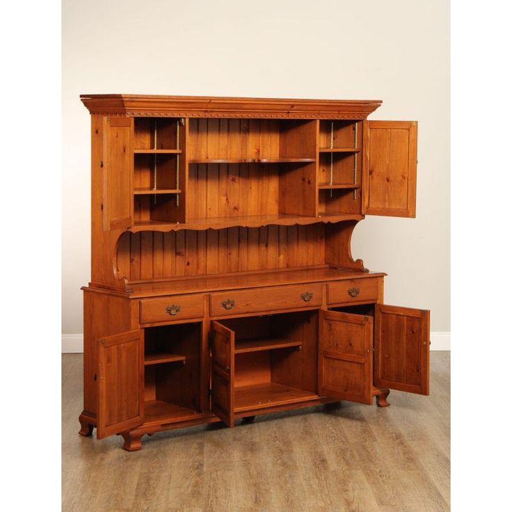 an old wooden desk with drawers and cupboards