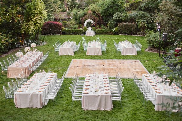 an outdoor wedding setup with tables and chairs