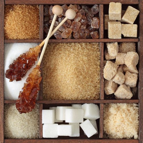 a wooden box filled with lots of different types of sugar and marshmallows