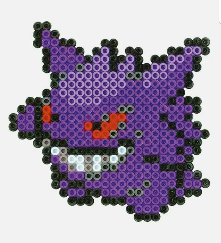 the pixel art is made out of legos and it looks like an angry cat