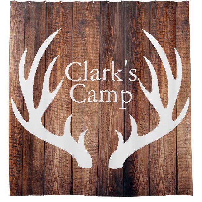 a shower curtain with the words clark's camp on it and two antlers