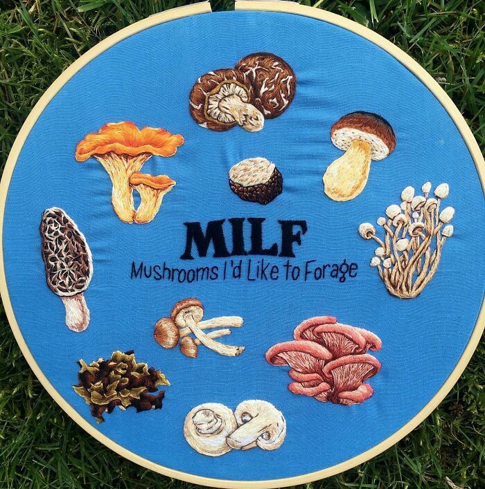 a blue plate with mushrooms on it sitting in the grass