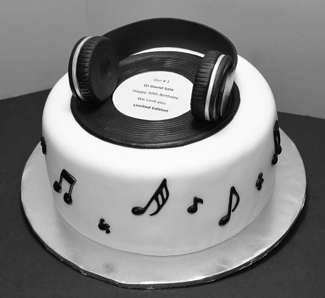 a cake decorated with headphones and music notes