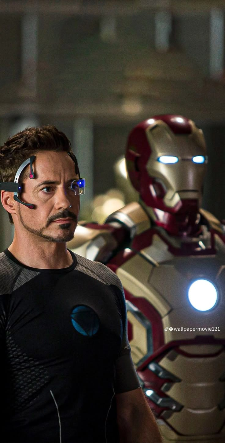 iron man and tony starke in the avengers 2 movie, with their faces glowing