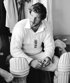 black and white photograph of a man sitting in a chair