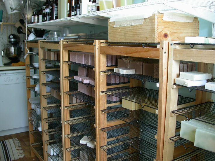 the shelves in the kitchen are filled with dishes