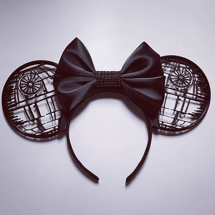 a mickey mouse ears with a black bow