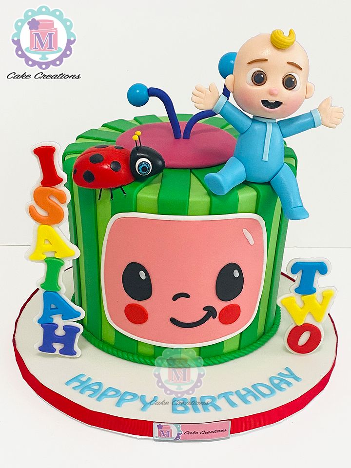 a birthday cake with an image of a baby on top