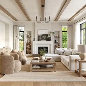 a living room filled with furniture and a fire place in the middle of a room