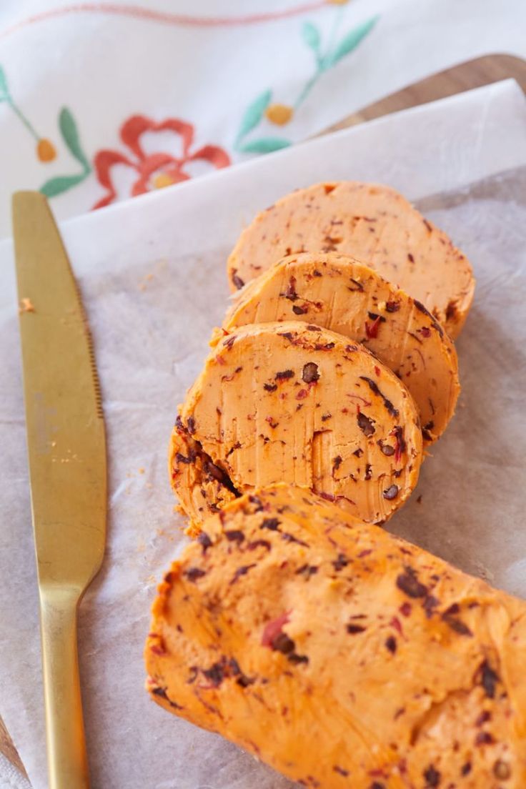 slices of bread sitting on top of a napkin next to a knife