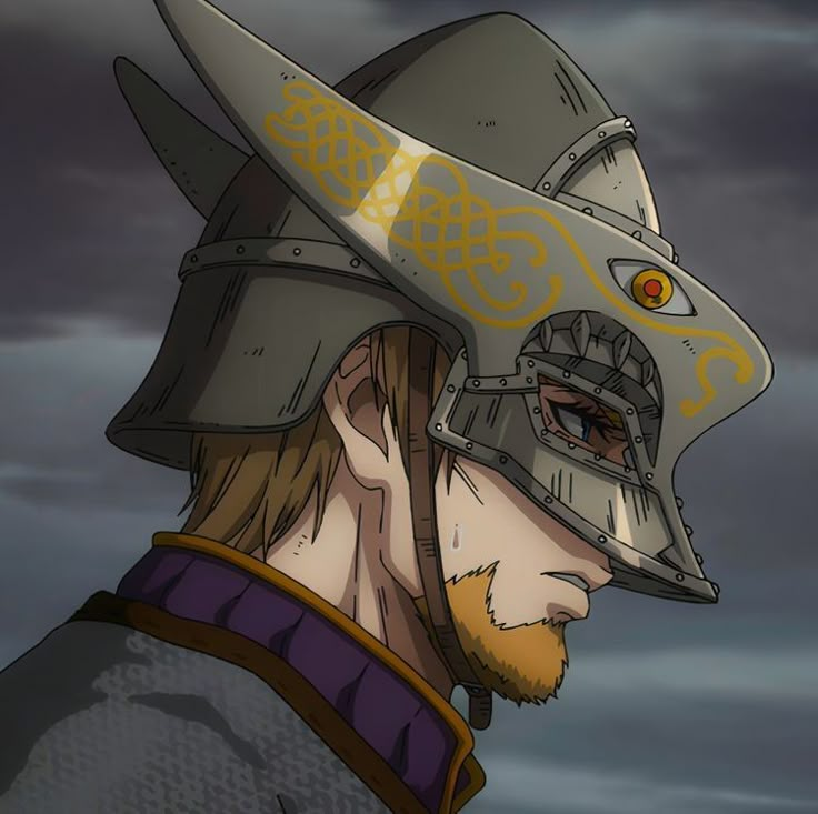 a man with a helmet on his head in front of a dark sky and clouds