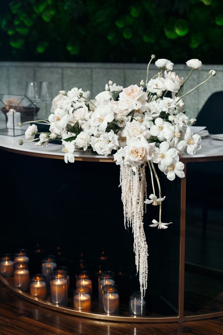 a table with candles and flowers on it